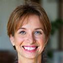 Portrait of Sarah M., smiling woman in her 40s